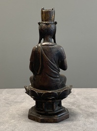 A Chinese bronze seated Guanyin on a lotus throne, probably Liao