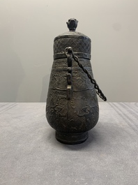 A Chinese archaistic bronze 'Taotie' wine vessel and cover, 'you 卣', Ming
