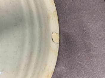 A rare Chinese Swatow slip-decorated pale-green-glazed 'dragon' dish, Ming