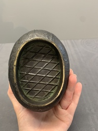 A Chinese archaistic bronze 'Taotie' wine vessel and cover, 'you 卣', Ming