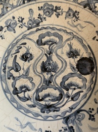 A Chinese Swatow blue and white dish with stylised floral design, Ming