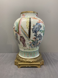 A Chinese famille rose gilt bronze mounted vase with figural design, Yongzheng
