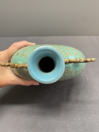 A Chinese gilt-decorated famille rose turquoise 'monkeys' and 'dogs' moon flask, Qianlong mark, 20th C.