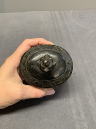 A Chinese archaistic bronze 'Taotie' wine vessel and cover, 'you 卣', Ming