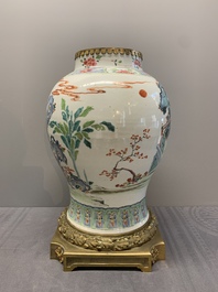 A Chinese famille rose gilt bronze mounted vase with figural design, Yongzheng
