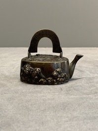 A Japanese bronze 'shishi lions' water dropper, Meiji, 19th C.