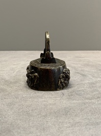 A Japanese bronze 'shishi lions' water dropper, Meiji, 19th C.