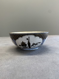 A pair of Chinese Canton enamel 'antiquities' bowls, Yongzheng/Qianlong