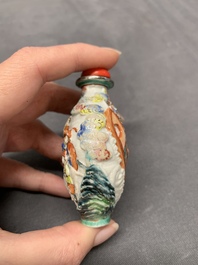 A Chinese famille rose relief-molded snuff bottle with narrative design, Xianfeng mark and of the period