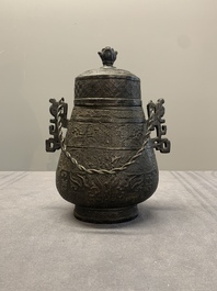 A Chinese archaistic bronze 'Taotie' wine vessel and cover, 'you 卣', Ming