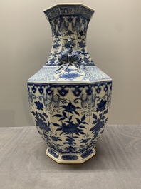 A pair of Chinese blue and white octagonal vases with floral design, 19th C.