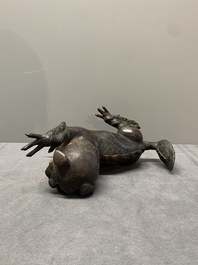 A rare Chinese bronze lion-form incense burner and cover, Song/Ming