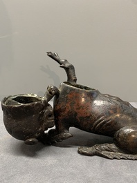 A rare Chinese bronze lion-form incense burner and cover, Song/Ming