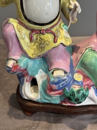 A Chinese famille rose group of Hehe Erxian on wooden stand, Qianlong