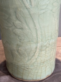 A Chinese Longquan celadon cylindrical vase with incised floral design, Ming