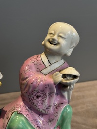 A Chinese famille rose group of Hehe Erxian on wooden stand, Qianlong