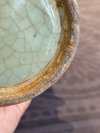 A Chinese Longquan celadon cylindrical vase with incised floral design, Ming