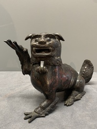 A rare Chinese bronze lion-form incense burner and cover, Song/Ming
