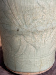 A Chinese Longquan celadon cylindrical vase with incised floral design, Ming