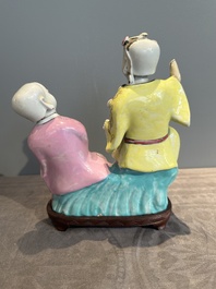 A Chinese famille rose group of Hehe Erxian on wooden stand, Qianlong