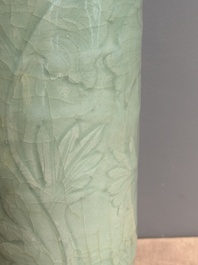 A Chinese Longquan celadon cylindrical vase with incised floral design, Ming