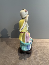 A Chinese famille rose group of Hehe Erxian on wooden stand, Qianlong
