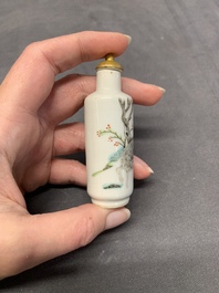 Four Chinese famille rose, verte and blue and white snuff bottles, Qianlong mark, 19/20th C.