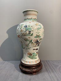 A fine Chinese famille verte 'mythical creatures' vase on a reticulated wooden stand, Kangxi