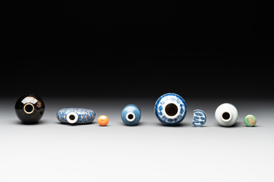 Five Chinese blue and white, iron-red and mirror-black-glazed snuff bottles, Qianlong mark, 19th C.