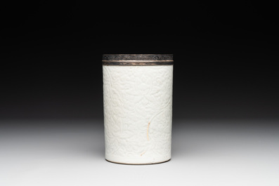 A Chinese silver mounted incised white-glazed 'lotus scroll' brush pot, Kangxi