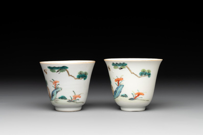 A pair of Chinese famille rose 'monkey and deer' cups and saucers, Tongzhi mark and of the period