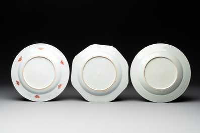 Two Chinese famille rose plates and an Imari-style armorial plate, Kangxi/Yongzheng