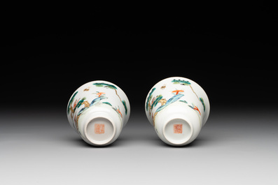 A pair of Chinese famille rose 'monkey and deer' cups and saucers, Tongzhi mark and of the period