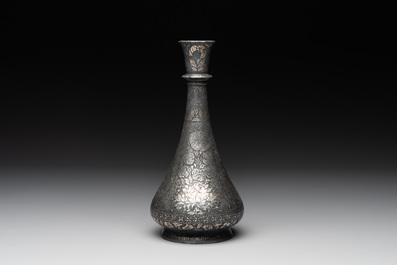 A bidriware vase, a steel hookah cup and three copper alloy hookah mounts, India/Persia, 19th C.