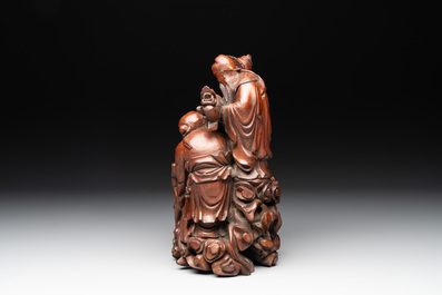 A Chinese carved wooden 'Fu Lu Shou' group, 19/20th C.