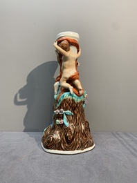 A Chinese export faux-bois stand with two putti and two famille rose boys, Qianlong/Jiaqing