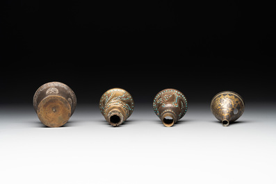 A bidriware vase, a steel hookah cup and three copper alloy hookah mounts, India/Persia, 19th C.