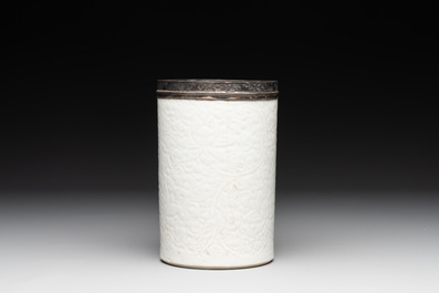 A Chinese silver mounted incised white-glazed 'lotus scroll' brush pot, Kangxi