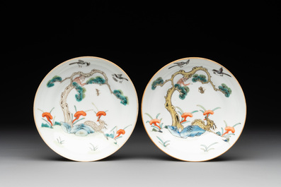A pair of Chinese famille rose 'monkey and deer' cups and saucers, Tongzhi mark and of the period