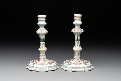 A pair of rare Chinese export famille rose candlesticks with floral design, Yongzheng/Qianlong