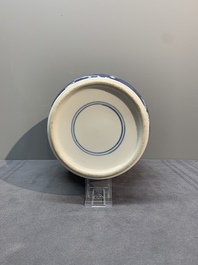 A pair of Chinese blue and white 'gu' vases, three jars, a plate and a plaque, Kangxi mark, 19th C.