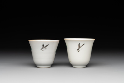 A pair of Chinese famille rose 'monkey and deer' cups and saucers, Tongzhi mark and of the period