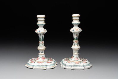 A pair of rare Chinese export famille rose candlesticks with floral design, Yongzheng/Qianlong