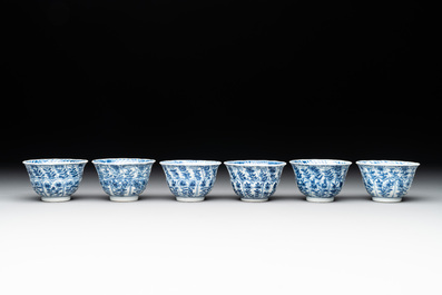Six Chinese blue and white cups and saucers with floral design, Kangxi
