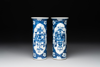 A pair of Chinese blue and white 'gu' vases, three jars, a plate and a plaque, Kangxi mark, 19th C.
