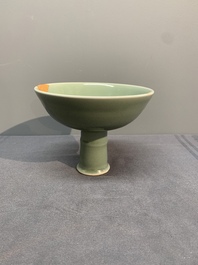 A Chinese Longquan celadon stem cup and two saucers, Ming