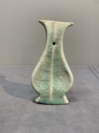 A Chinese Longquan celadon lobed bottle vase, Song