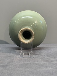 A Chinese Longquan celadon stem cup and two saucers, Ming
