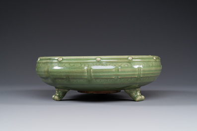 A Chinese Longquan celadon tripod censer on wooden stand, Yuan/Ming