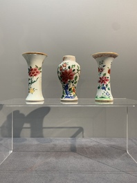 A Chinese famille rose tea caddy, two covered milk jugs and three vases, Yongzheng/Qianlong